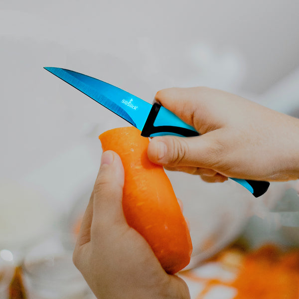 https://www.silislick.com/cdn/shop/files/R5FullBlueParingKnife-Lifestyle-CuttingCarrots_grande.jpg?v=1692368417