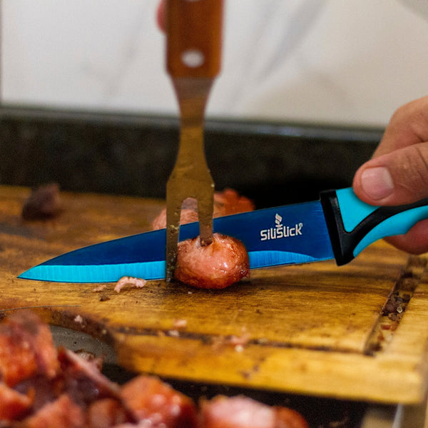 https://www.silislick.com/cdn/shop/products/Bluebladechefknifecuttingpotatoes_grande.jpg?v=1667411066