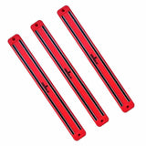 Set of three red magnetic knife and tool racks for wall mounting and organization